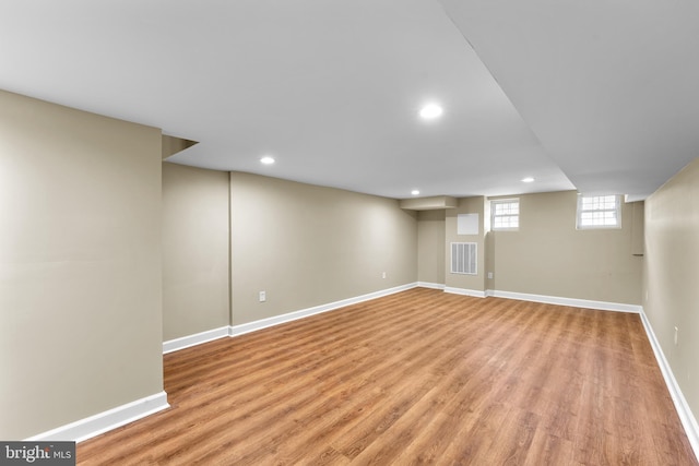 basement featuring light hardwood / wood-style floors