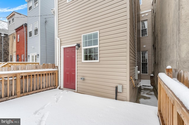 view of snow covered property entrance