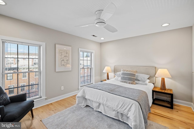 bedroom featuring hardwood / wood-style floors and ceiling fan