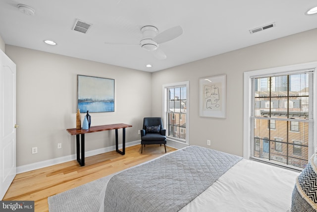 bedroom with wood-type flooring and ceiling fan