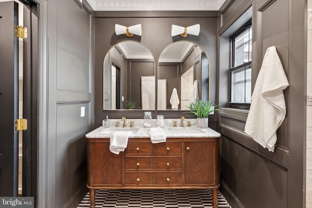 bathroom featuring vanity and ornamental molding