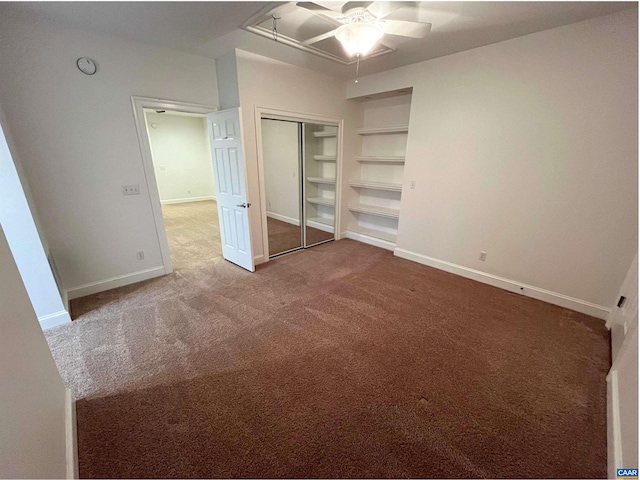 unfurnished bedroom with ceiling fan, a closet, and carpet