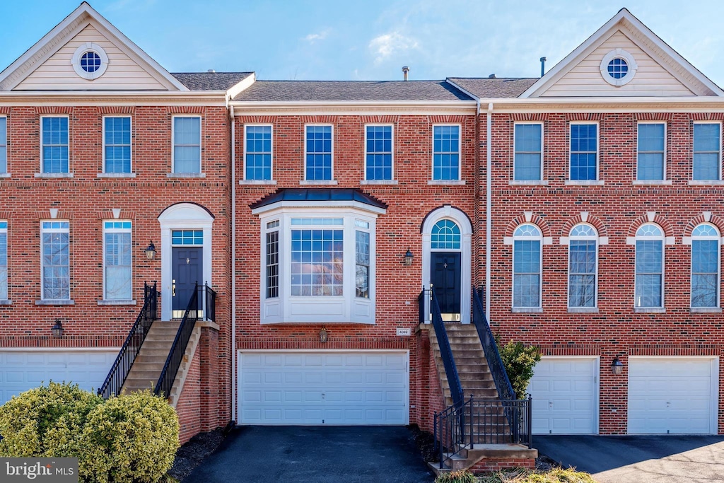 multi unit property featuring a garage