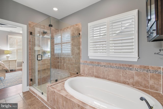 bathroom featuring tile patterned flooring and plus walk in shower