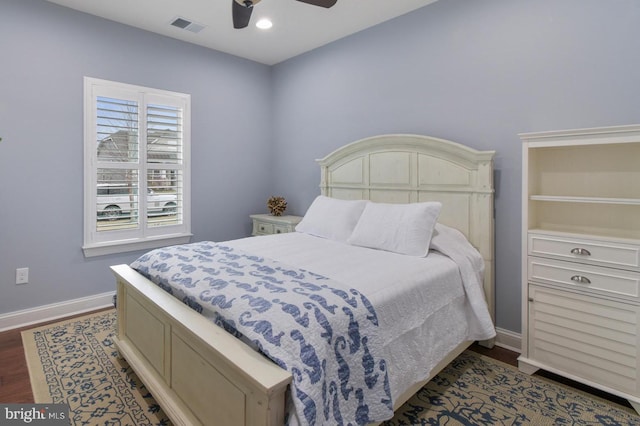 bedroom featuring dark hardwood / wood-style flooring and ceiling fan