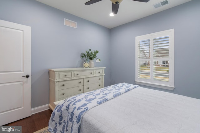 bedroom featuring ceiling fan and dark hardwood / wood-style floors