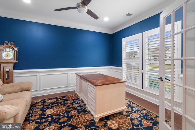 office area featuring hardwood / wood-style flooring, a wealth of natural light, ornamental molding, and ceiling fan