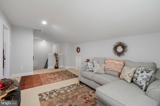 carpeted living room featuring lofted ceiling