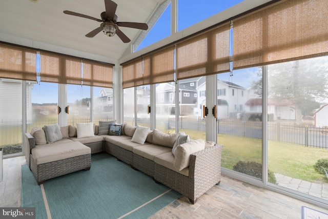 sunroom / solarium with vaulted ceiling and ceiling fan