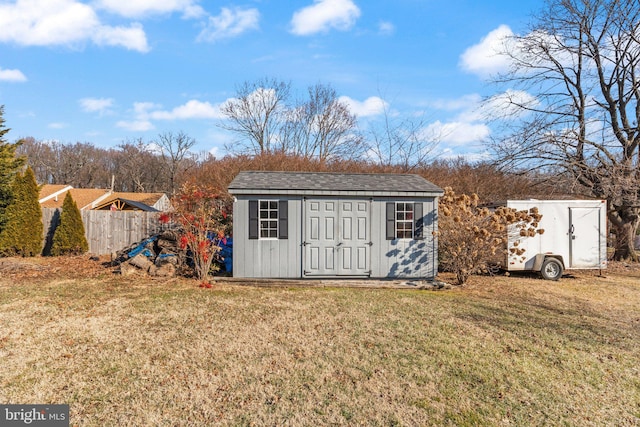 view of outdoor structure featuring a lawn