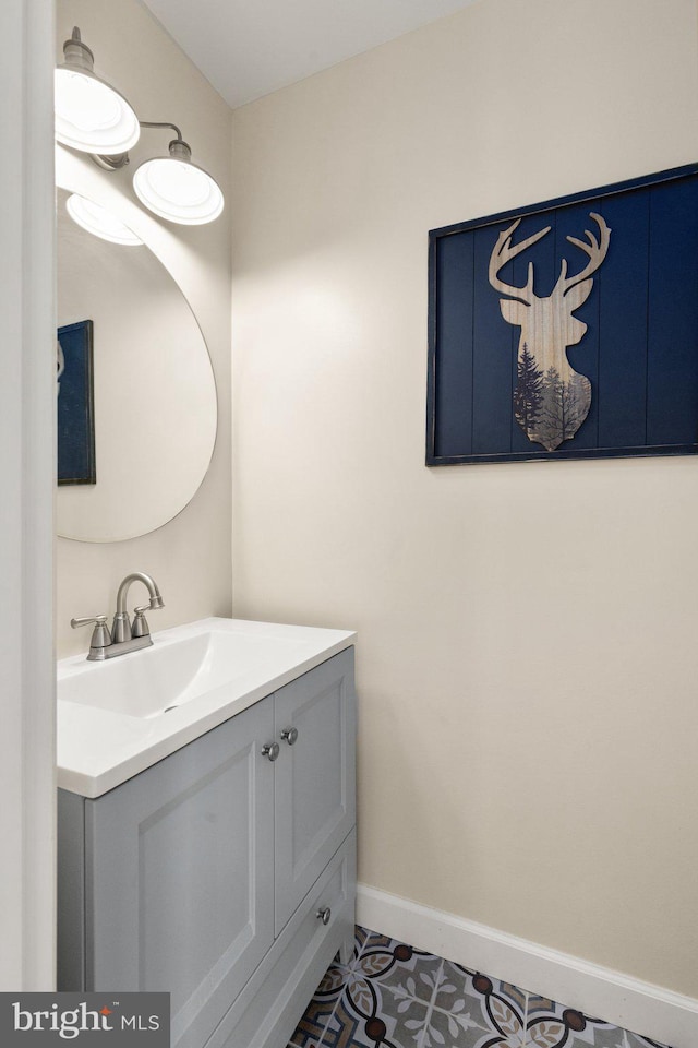 bathroom with tile patterned flooring and vanity