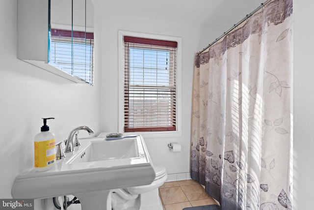 bathroom with sink and tile patterned flooring