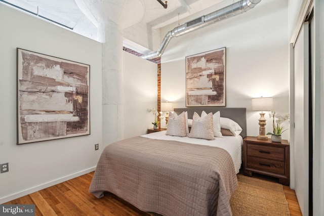 bedroom featuring hardwood / wood-style flooring