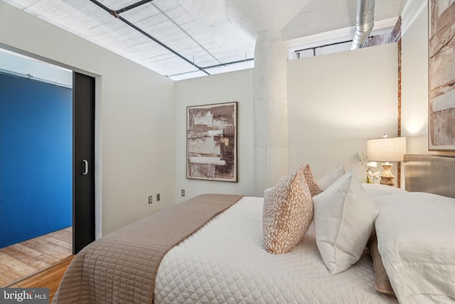 bedroom featuring wood-type flooring