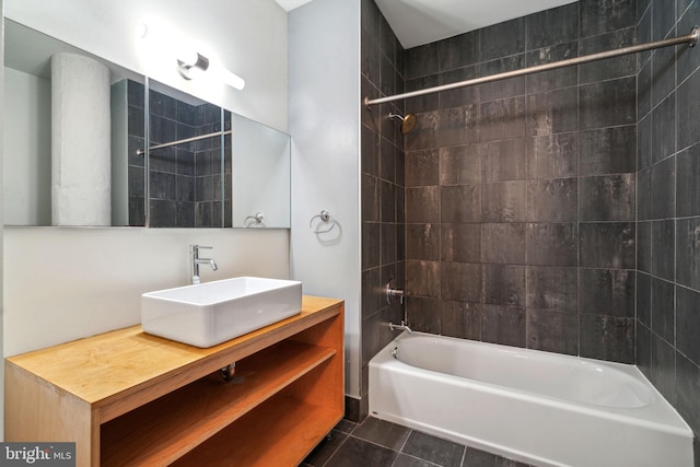 bathroom with vanity, tiled shower / bath combo, and tile patterned floors