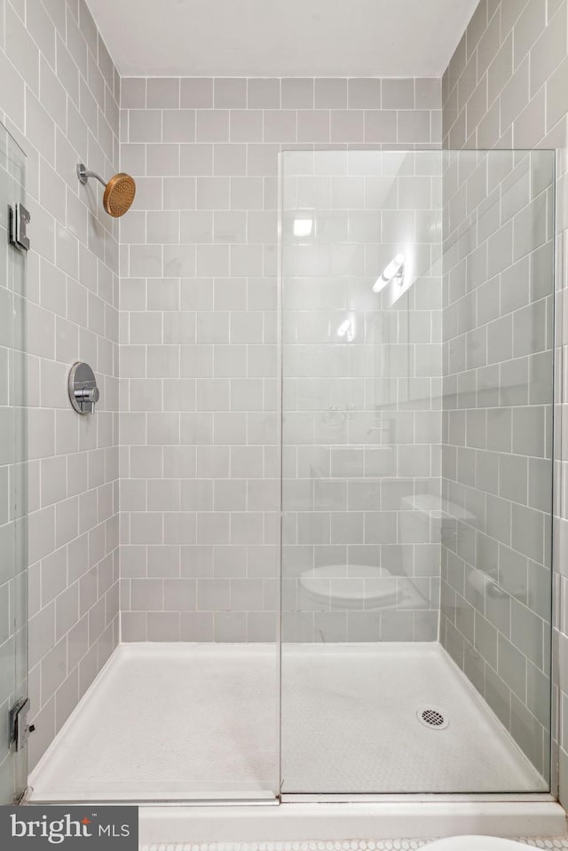 bathroom featuring an enclosed shower