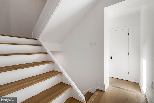 stairway featuring hardwood / wood-style flooring