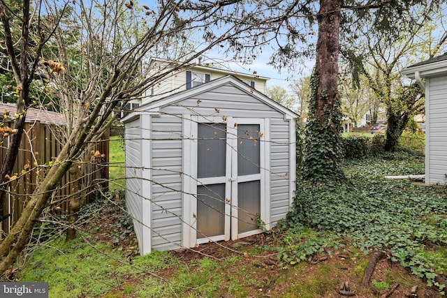 view of shed featuring a fenced backyard
