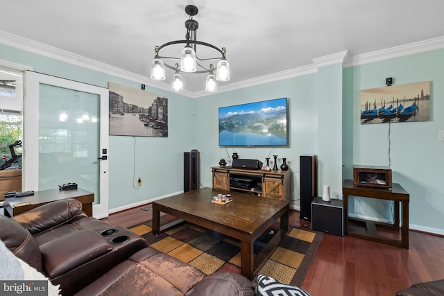 living room with wood finished floors, an inviting chandelier, baseboards, and ornamental molding