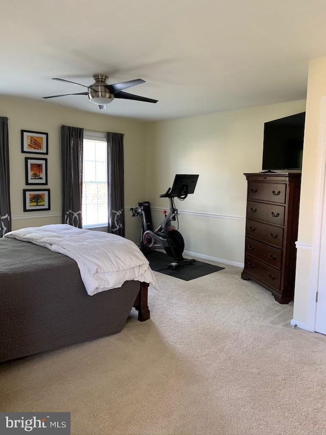 bedroom with carpet floors, a ceiling fan, and baseboards