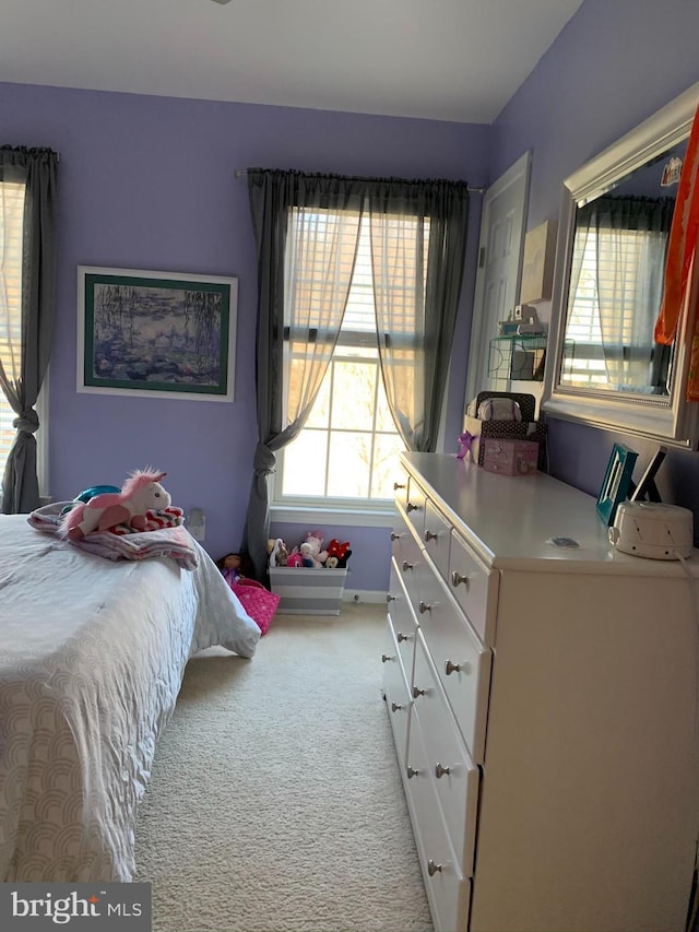 carpeted bedroom with baseboards