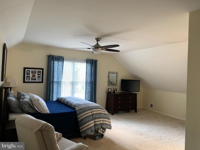 bedroom featuring vaulted ceiling, a ceiling fan, baseboards, and carpet flooring