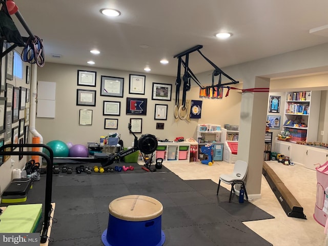 workout area featuring recessed lighting