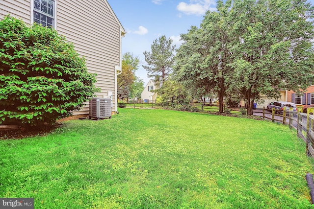 view of yard with central air condition unit
