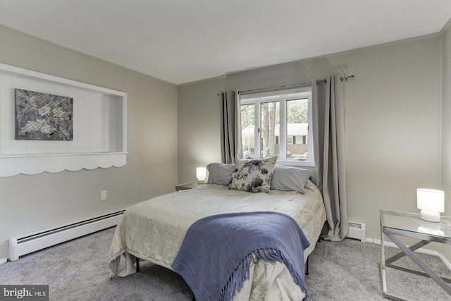 carpeted bedroom featuring a baseboard heating unit