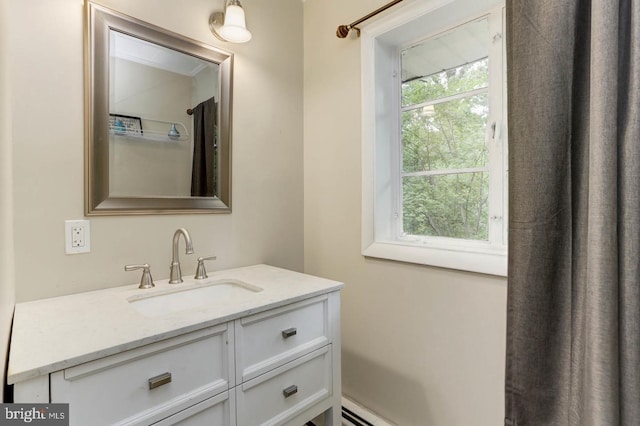 bathroom featuring a healthy amount of sunlight and vanity