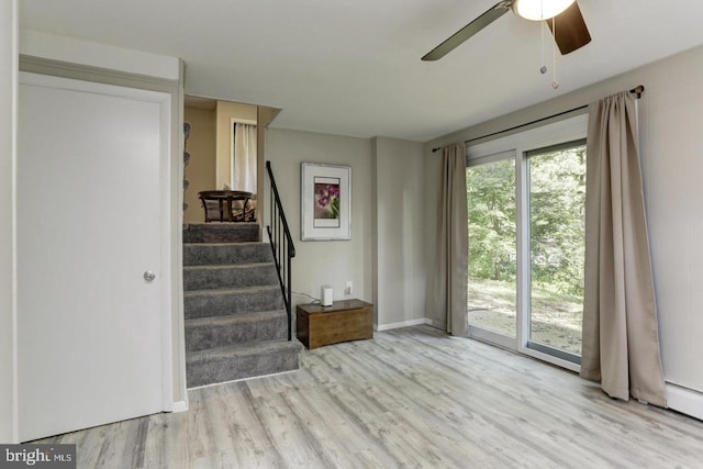 interior space with light hardwood / wood-style flooring and ceiling fan