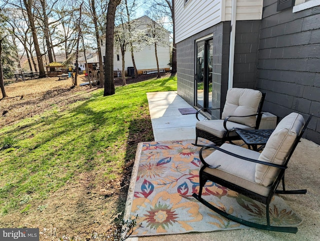 view of patio / terrace featuring fence