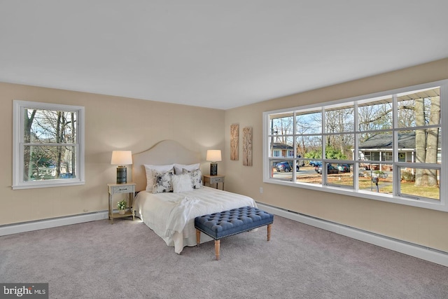 carpeted bedroom featuring a baseboard radiator