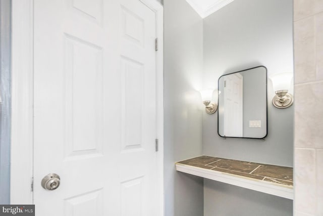 bathroom featuring crown molding