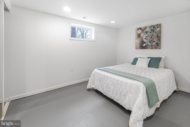 bedroom featuring finished concrete flooring, baseboards, visible vents, and recessed lighting