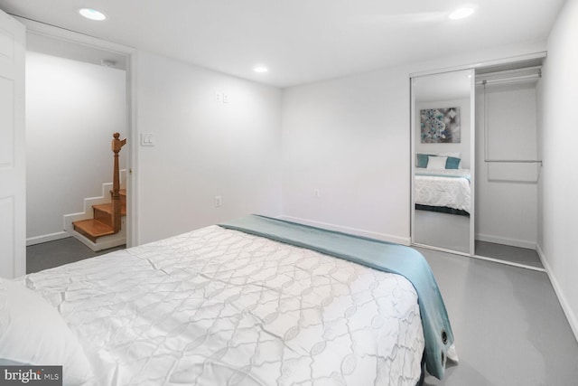 bedroom with recessed lighting, a closet, and baseboards