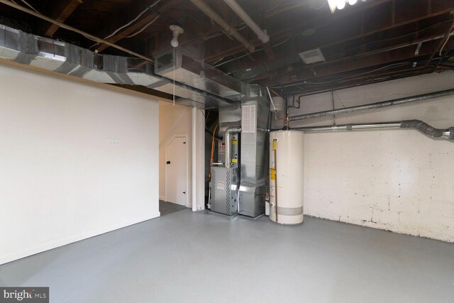 unfinished basement with heating unit and water heater