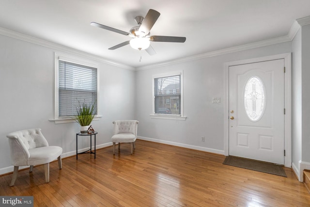 foyer entrance with a wealth of natural light and light wood-style flooring