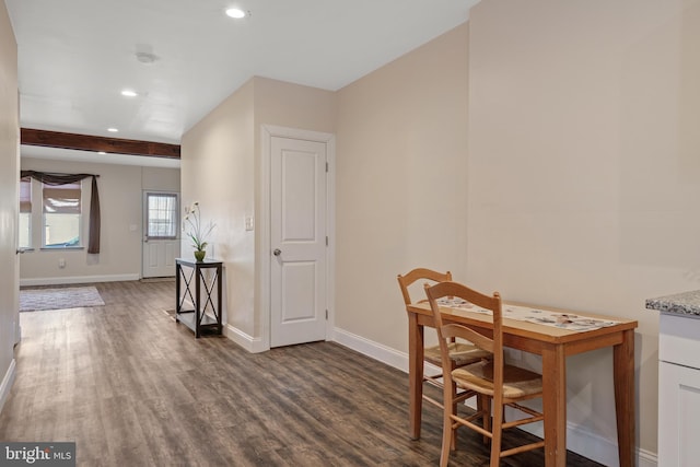 dining area with dark hardwood / wood-style floors