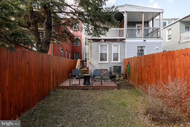 back of property featuring central AC, a patio, and a yard