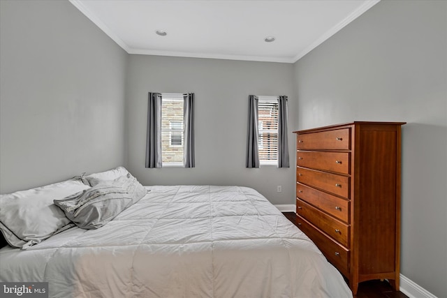 bedroom featuring crown molding and hardwood / wood-style flooring