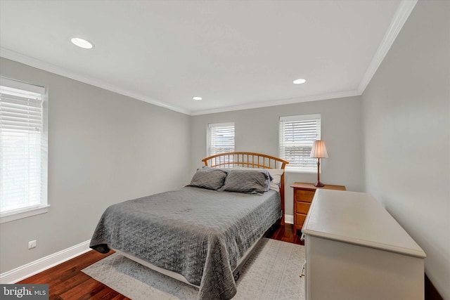 bedroom featuring crown molding and dark wood-type flooring