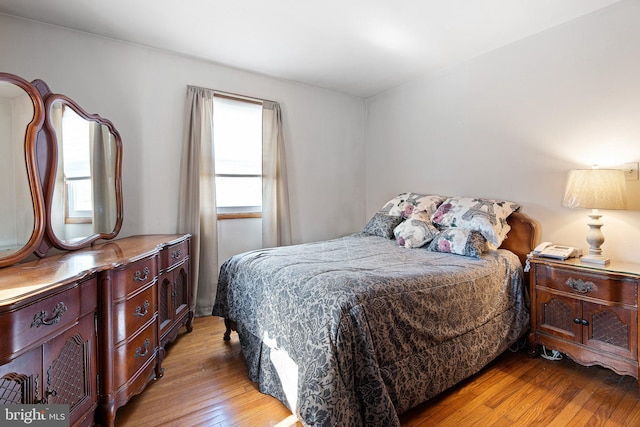 bedroom with light wood-type flooring