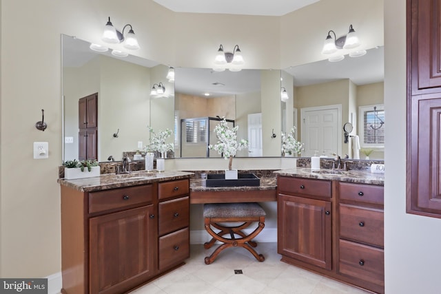 bathroom with vanity and a shower with shower door