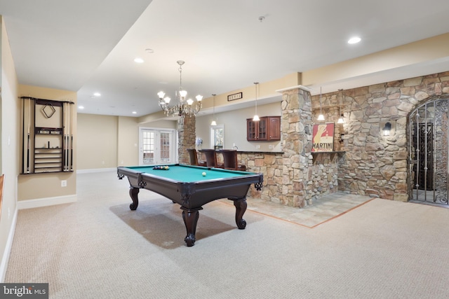 game room with indoor bar, light colored carpet, and pool table