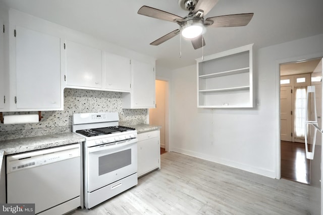 kitchen featuring tasteful backsplash, white appliances, light hardwood / wood-style floors, and white cabinets