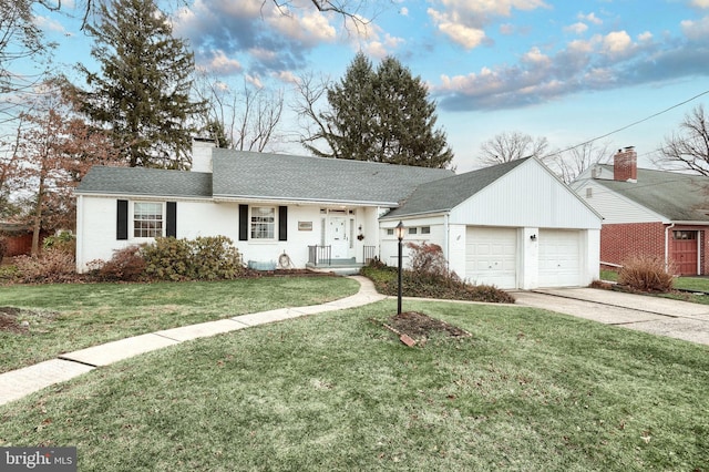 ranch-style home with a garage and a front yard