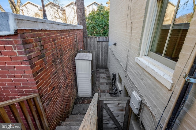 view of side of home with brick siding