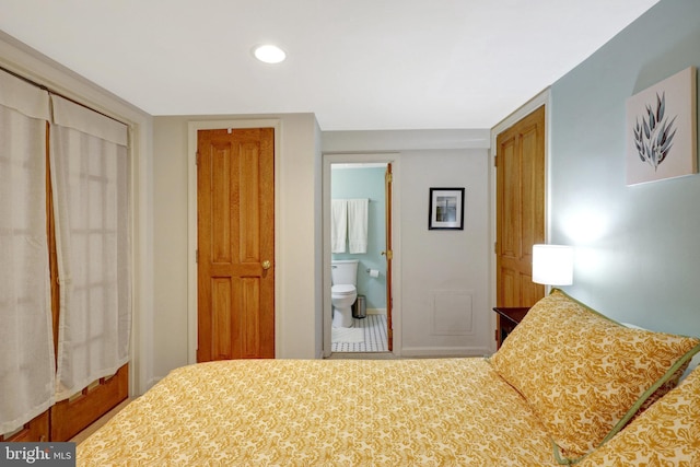 bedroom with recessed lighting, a closet, and ensuite bathroom