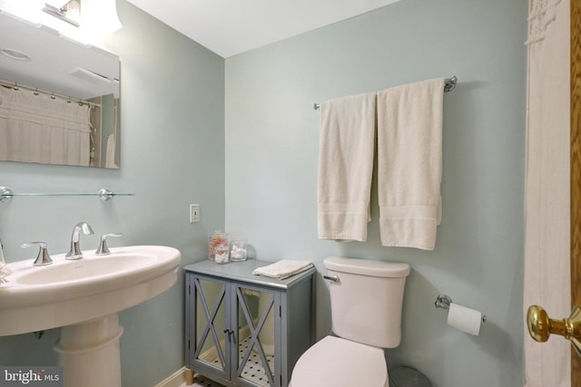 bathroom with a sink and toilet